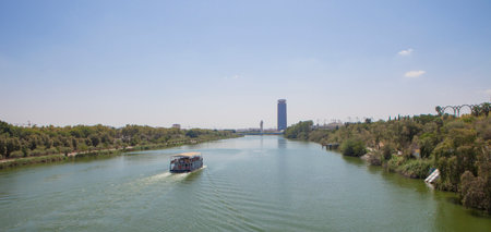 Fluvial tourist cruiser of Guadalquivir river, Seville, Andalusia, Spain. Long formatの写真素材
