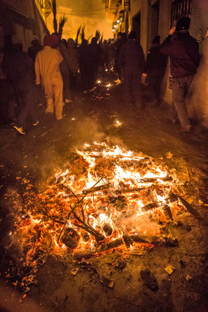 Jarandilla, Spain - Dec 7th, 2025: Escobazos Festival of Jarandilla de la Vera. Locals blazing broom...
