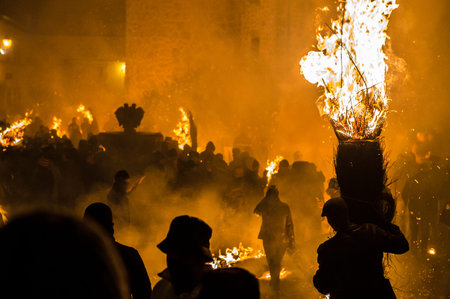 Escobazos Festival of Jarandilla de la Vera. Locals bearing broom torches at night. Caceres, Spain