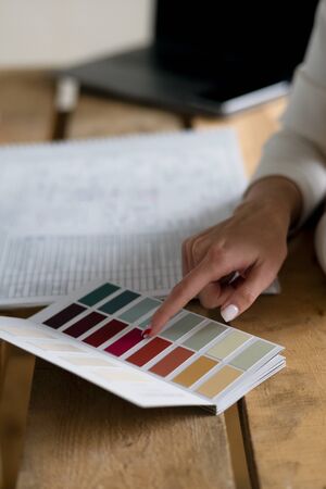 Designer choosing color with client