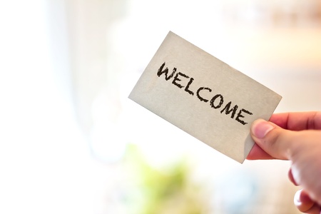 welcome card in hand の写真素材