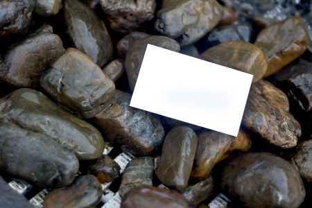 blank card on the rocksの写真素材