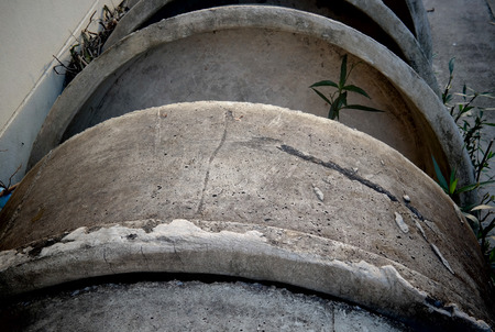 Concrete  pipes stack next to wall.jpg