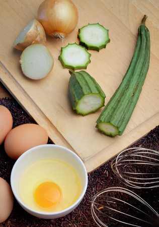 Vegetarian healthy food with gourd egg rice berry preparation at homeの写真素材