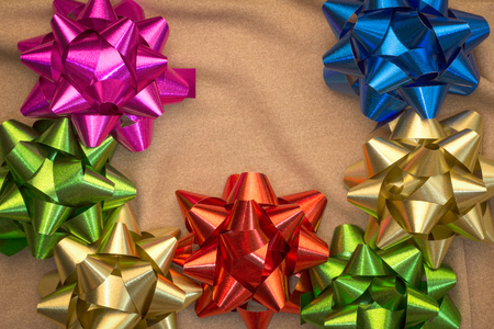 gift ribbon on beige background with text space above the ribbon.jpgの写真素材
