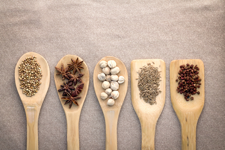 Various colorful spices in  wood spoon top viewの写真素材