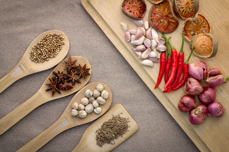 Various colorful spices on wooden table and wood plateの写真素材