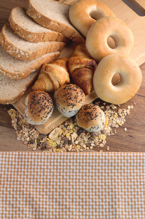 Different types of bread on the wood backgroundの写真素材