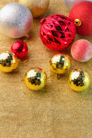 golden christmas balls on golden glitter backgoundの写真素材