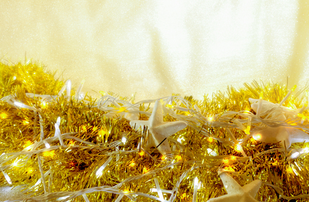 Christmas Holiday garland lights abstract glowing background. Beautiful border design with space for your textの写真素材