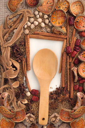 spices and herbs frame on a fabric background.の写真素材