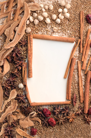 spices and herbs frame on a fabric background.の写真素材