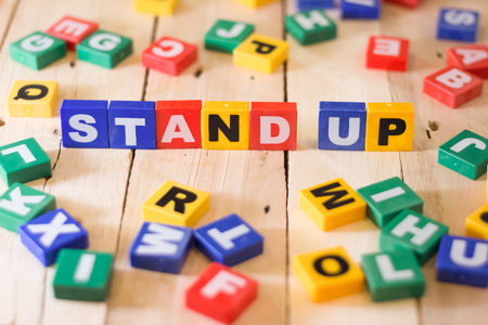stand up business concept on wooden background.jpgの写真素材