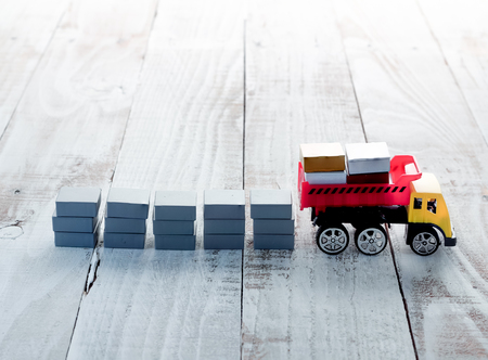 stacking blocks with truck toy on white wood floor.jpgの写真素材