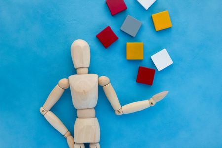 wood man with blank word plastic block on color backgroundの写真素材