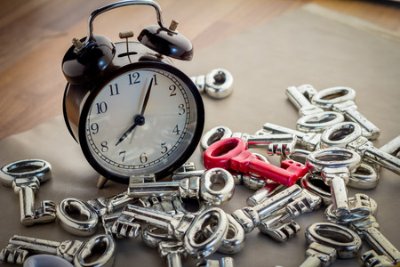 alarm clock and pile of keys morning light image.jpgの写真素材