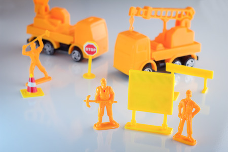 Under construction barrier. Blank signage. Traffic cones. Road sign. Construction Helmet.の写真素材