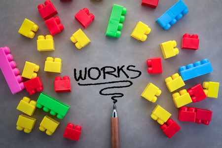 Business concept with word work drawing with plastic box and pencil on grey backgroundの写真素材