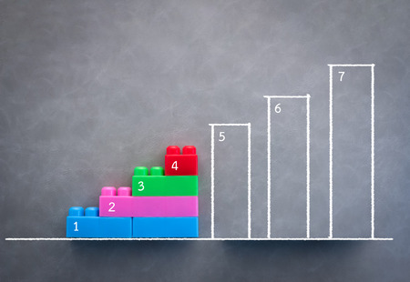 business steps up stairs to successful point with business doodles background.