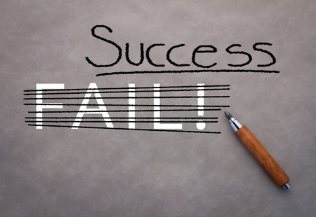 success concept with pencil and success word on grey backgroundの写真素材