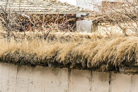 dry grass roof in old house in shangri-la chinaの写真素材