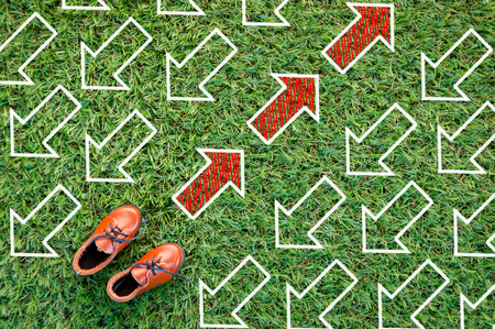 toy leather shoe on grass field texture background creativity cocneptの写真素材