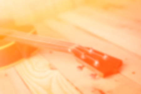 old ukulele on the wooden floor at terraceの写真素材