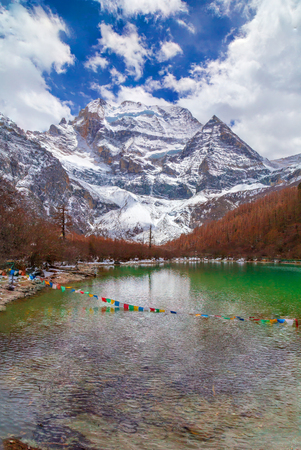 Autumn mountain lake landscape on a cloudy day in chinaの写真素材