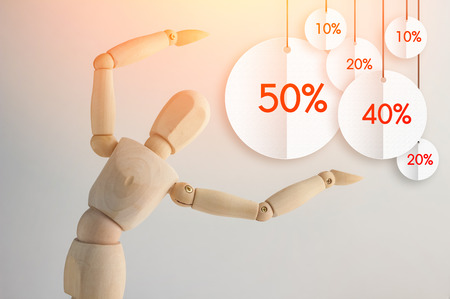 Wooden figure showing up flat tag discount discount promotion concept, copy space for your textの写真素材