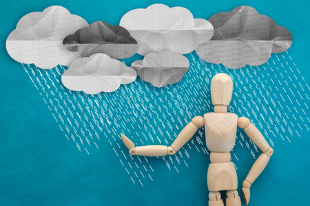 raining with wooden figure man creativity ideas conceptの写真素材