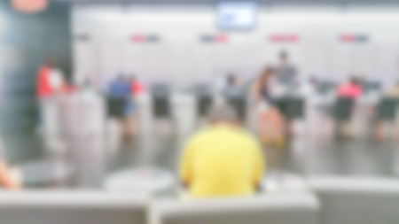 blur background of payment services interior.Payment with smartphone at checkout in nursery retail store,counter service at hotel for background usage.can use for background product .vintage toneの写真素材