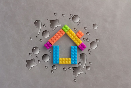 home model with water drop on grey background creativity ideas concept