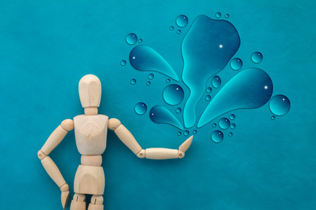 wood man figure with water splash creativity ideas conceptの写真素材