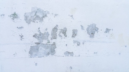 Cracked white concrete texture closeup background