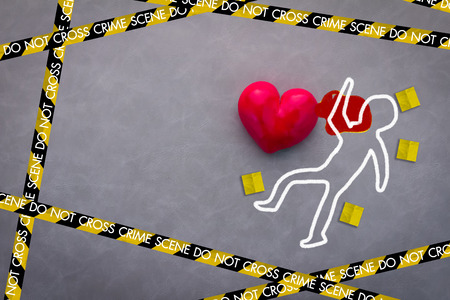 love victim crime scene concept with red heart on grey background