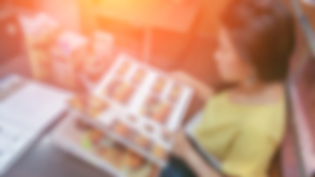 blur image background of girl order food from menuの写真素材