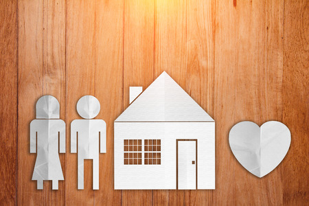 home sweet home family paper cut style on wooden table background.jpgの写真素材