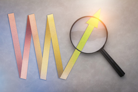 success business graph paper cut style with magnifying glass on grey background.jpgの写真素材