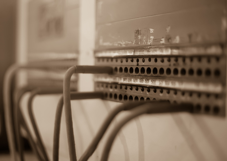 Old vintage telephone switchboard with monochrome color filter comunication concept
