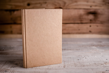 blank sketchbook on wooden background.jpgの写真素材