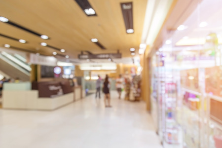 blurred people walk at the shopping mall store hallway in vacation weekend day:blur people movement background concept.out of focus concept.discount season conception.weekend monthly shopping.の写真素材