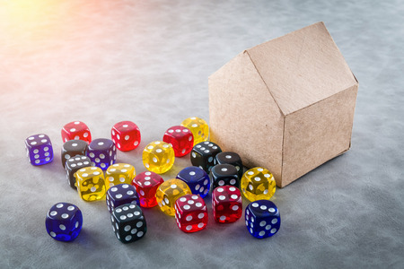 colorful glass dice with paper house model business ideas concept