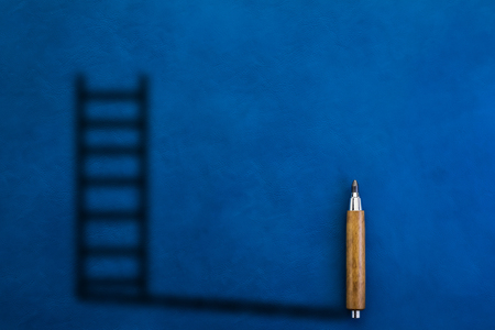 wooden pencil with shadow in ladder shape business solution ideas conceptの写真素材
