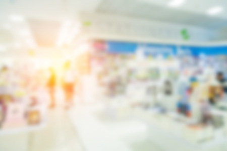 blur background image of shopping mall or department store with bokeh and people background usage conceptの写真素材