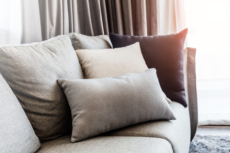 contemporary interior of Living room with part of sofa in sunny day and white curtain interior...