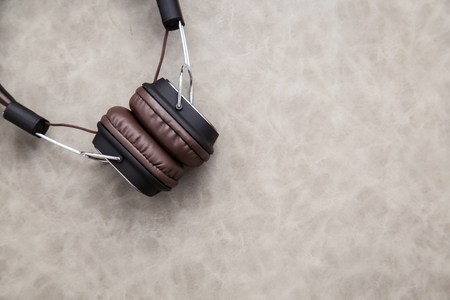 brown vintage style headphone on floor with free copy space for your creativity ideas textsの写真素材