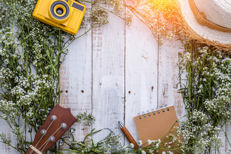 travel ideas concept with travel stuff ukulele, notebook ,pencil ,and vacation hat with background...