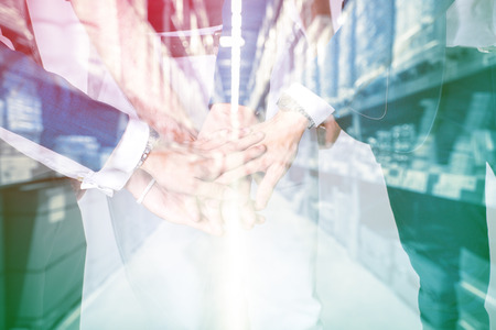 Team work business ideas concept. Business people with suit joining hands.