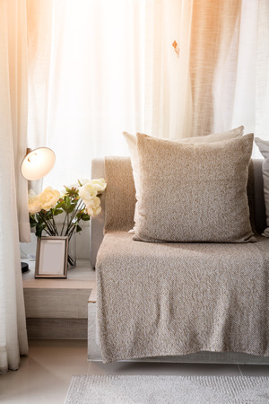 contemporary interior of Living room with part of sofa in sunny day and white curtain interior background conceptの写真素材