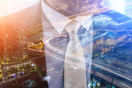 Double exposure photo a businessman and view of the city